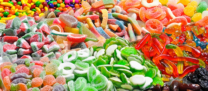 An assortment of gummy candies that are not good when taking care of dental implants.