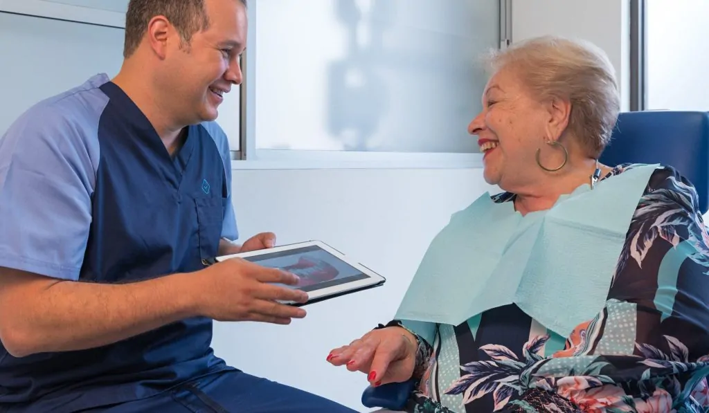 Dr. Bogarin with a permanent denture patient.