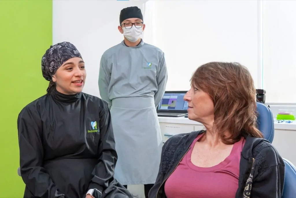 Full Mouth Implants doctors speaking with a patient