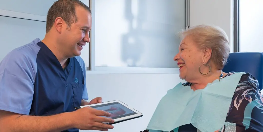 Dr. Bogarin with a permanent denture patient.